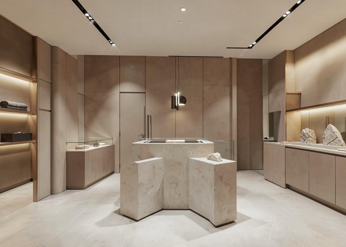 Minimal retail interior with stone display plinths and track lighting